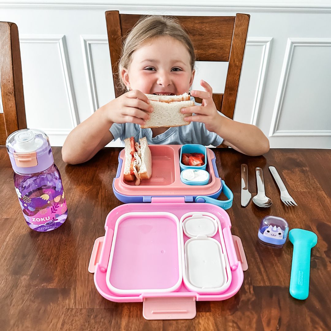 Girl Eating from Neat Bento