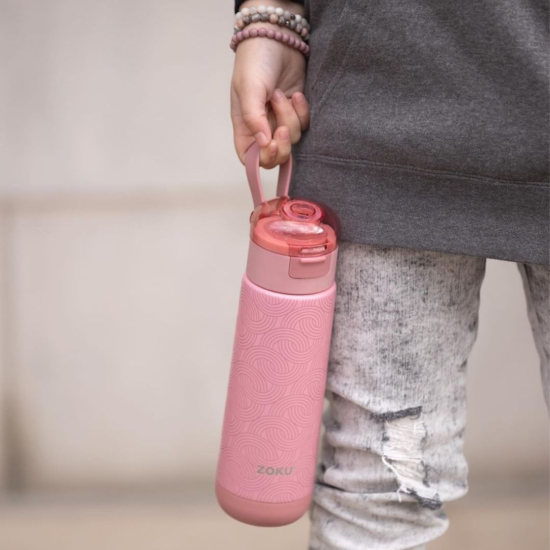 carrying pink sports bottle